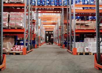 person in the middle of a warehouse